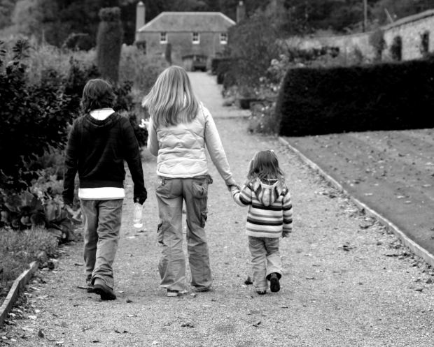 family children walking towards home